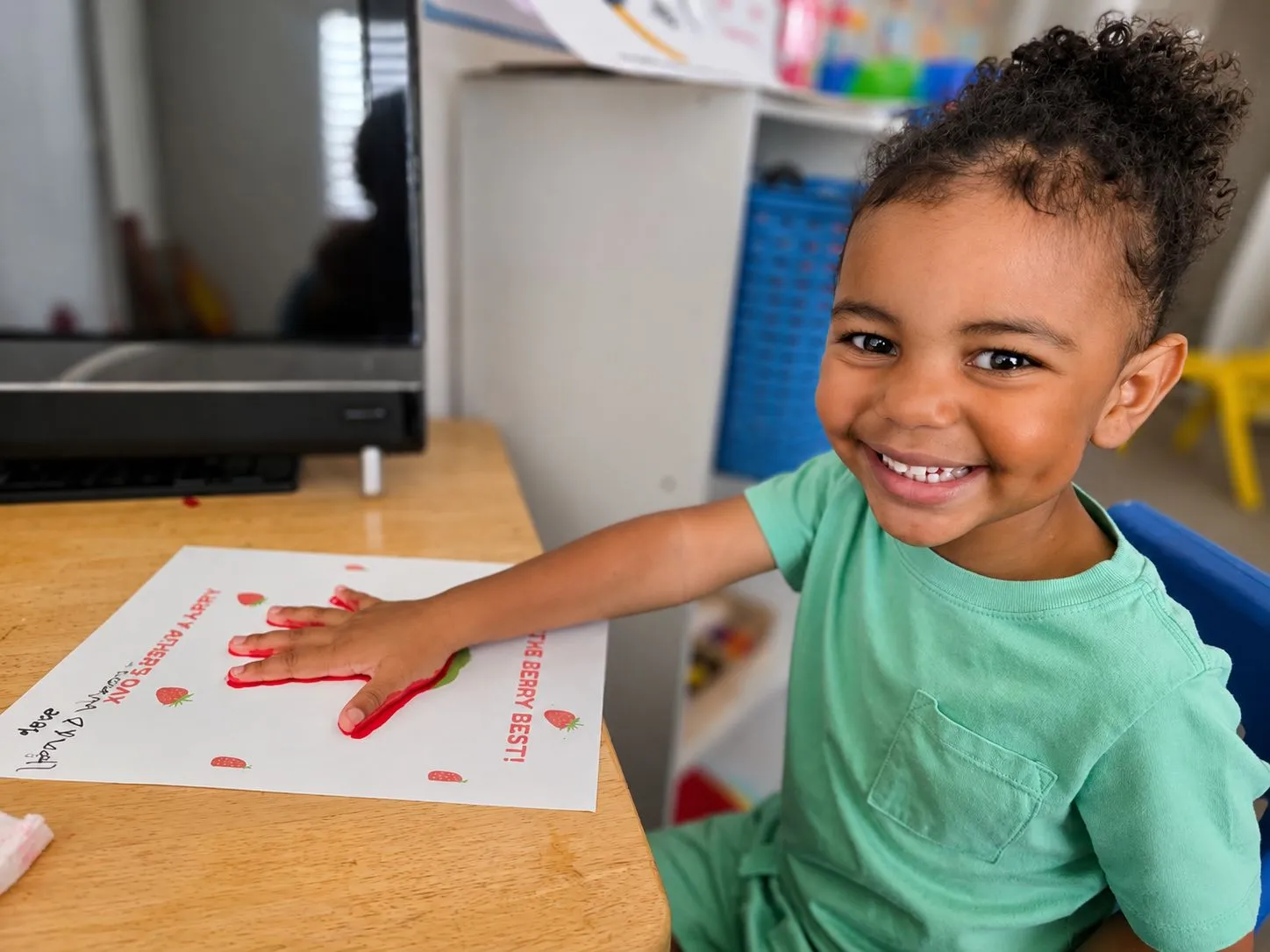 A teacher helping a child learn at Incredible Little Sprouts Academy